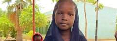 Elgeraif, Khartoum, Sudan, A girl child showing her drawings at the ERR in Elgeraif