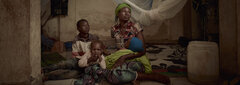 Burkina Faso, Sombewindé, with her children at the stadium of Kaya, in the Centre-Nord region of Burkina Faso.