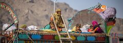 KANDAHAR, SOUTHERN AFGHANISTAN, An Afghan family arrives at the IOM Transit Center in Kandahar to receive the assistance.