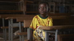 Fada, Burkina Faso, Dahani, a six-year old boy, looks out of his classroom window. After his village was attacked, Dahani and his family fled to Fada, where he started attending a remedial educational programme for out-of-school children.