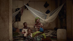 Burkina Faso, Sombewindé with her children at the stadium of Kaya in the Centre-Nord region of Burkina Faso.