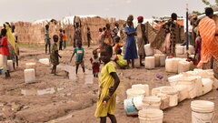 White Nile State, Refugee women and children line up for access to water in one of the refugee camps in White Nile State.