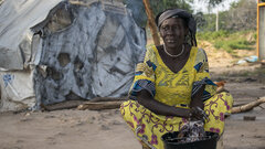 Birao, Central African Republic , A woman washes a cooking pan at a camp for displaced people.  